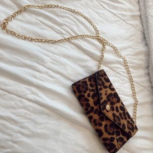 Francesca’s Cheetah print clutch.